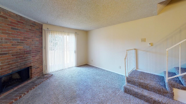 carpeted living room featuring a textured ceiling and a fireplace