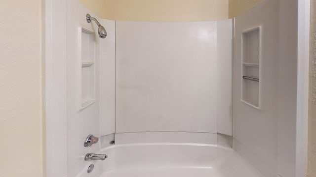 bathroom with shower / tub combination