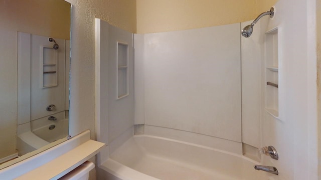 bathroom with vanity and shower / bathing tub combination