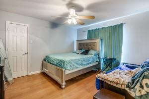 bedroom featuring ceiling fan and hardwood / wood-style flooring