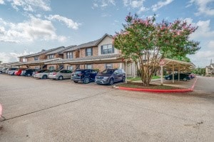 exterior space with a carport