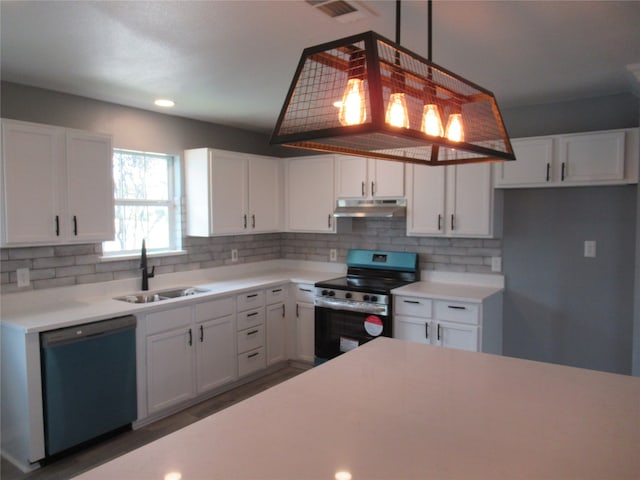 kitchen featuring white cabinets, tasteful backsplash, appliances with stainless steel finishes, and sink