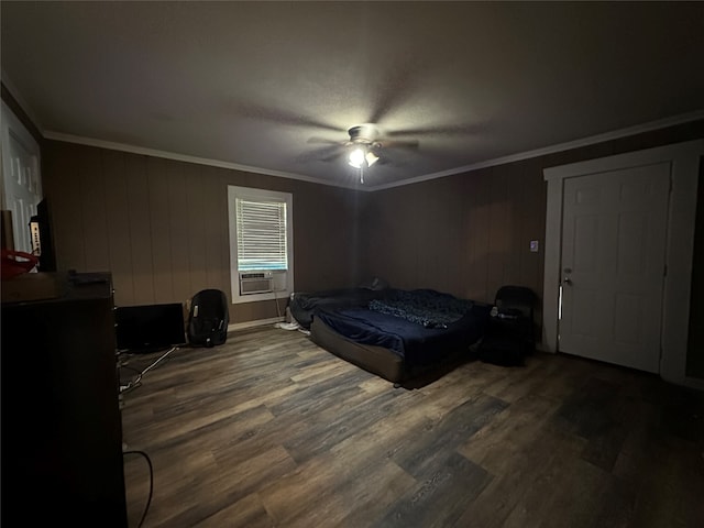 bedroom featuring wood-type flooring, ceiling fan, and crown molding