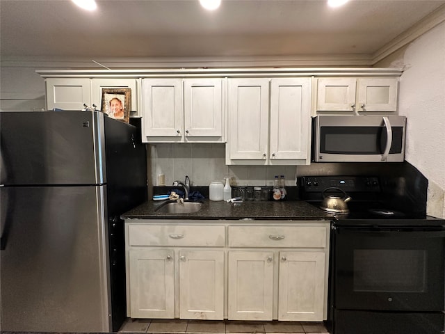 kitchen with stainless steel appliances, sink, backsplash, light tile patterned floors, and crown molding