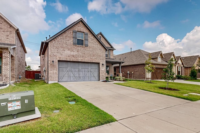 view of front of house with a garage, cooling unit, and a front yard