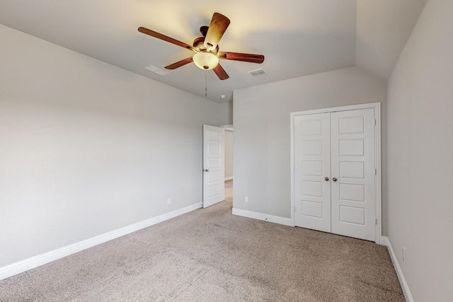 unfurnished bedroom with ceiling fan, a closet, and carpet