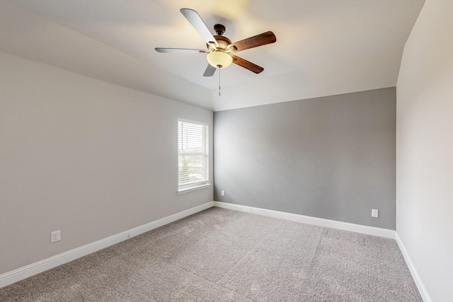 empty room with ceiling fan and carpet