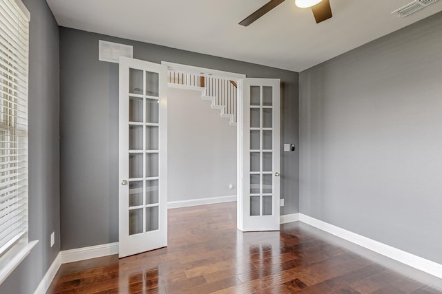 unfurnished room featuring french doors, ceiling fan, and dark hardwood / wood-style floors