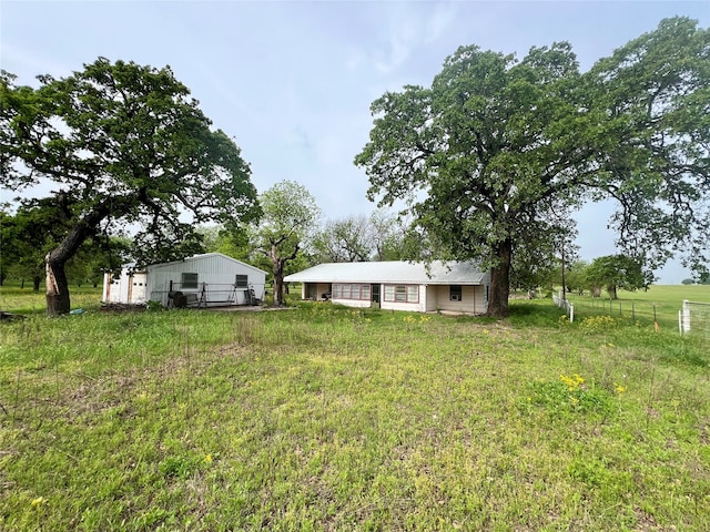 view of yard with a rural view