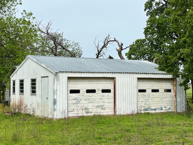 garage featuring a yard