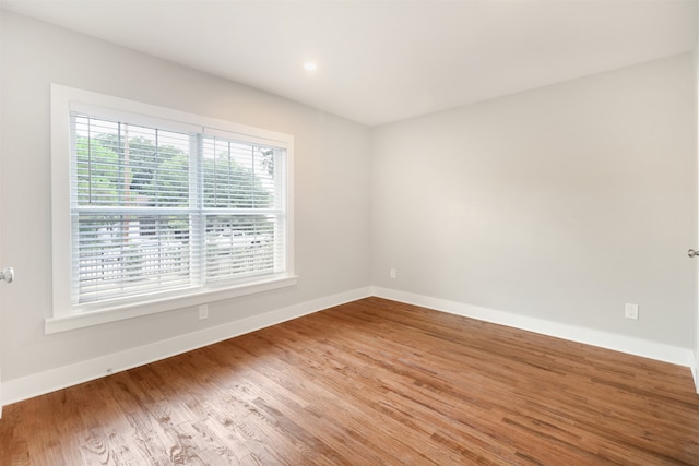 spare room featuring hardwood / wood-style flooring