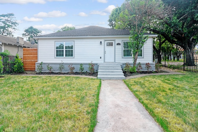 single story home featuring a front yard