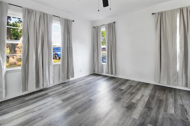 empty room featuring hardwood / wood-style flooring and ceiling fan