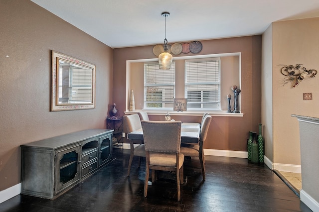 dining area with dark wood-type flooring