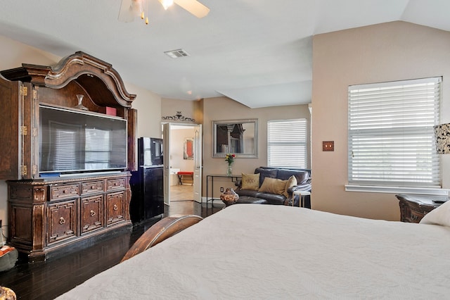 bedroom featuring vaulted ceiling, ceiling fan, and dark hardwood / wood-style floors