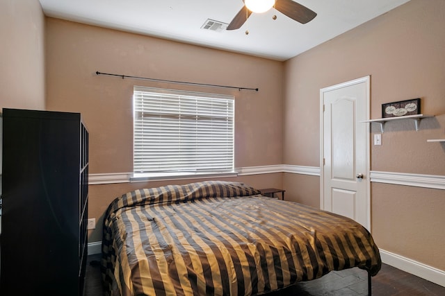 bedroom featuring hardwood / wood-style flooring and ceiling fan