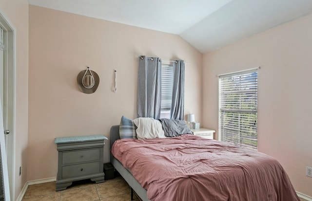 tiled bedroom with vaulted ceiling