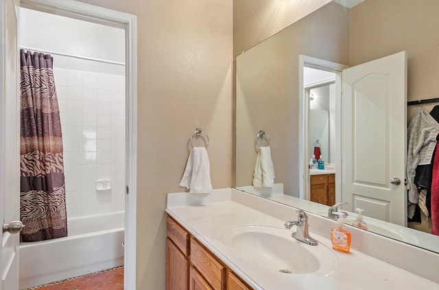 bathroom with vanity, shower / bathtub combination with curtain, and tile patterned flooring