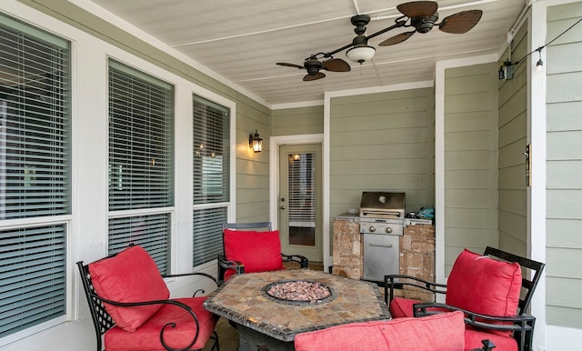 view of patio featuring ceiling fan and an outdoor fire pit