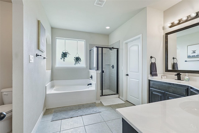 full bathroom with vanity, shower with separate bathtub, tile patterned floors, and toilet