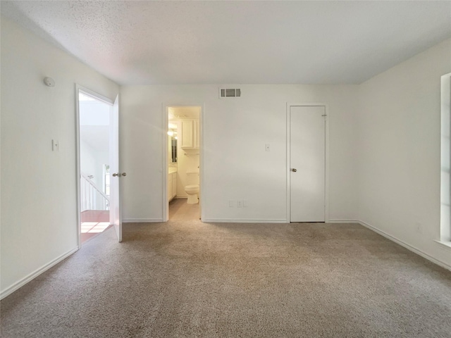 interior space featuring a textured ceiling