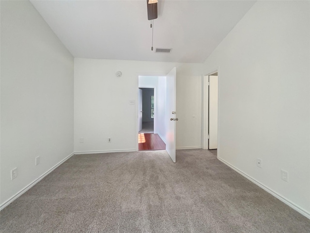 unfurnished room featuring light carpet