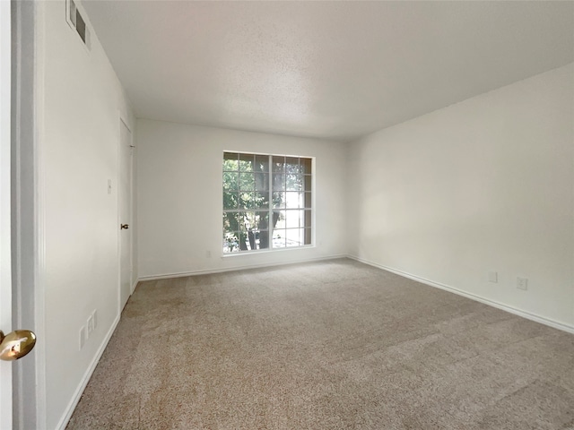 empty room with carpet flooring