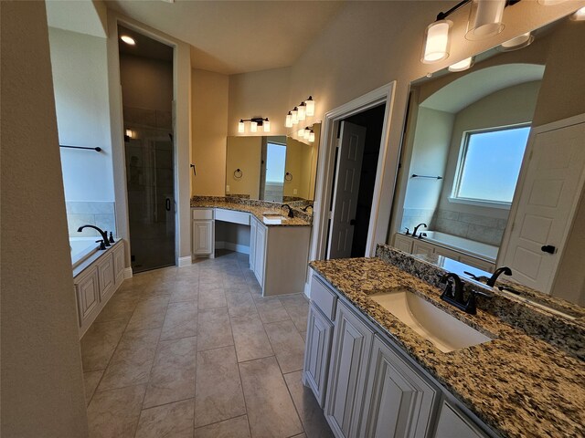 bathroom featuring vanity, plus walk in shower, and tile patterned floors