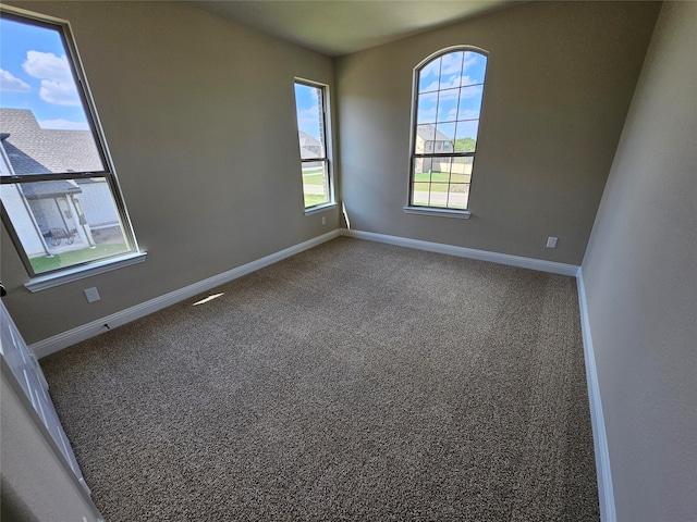 empty room featuring carpet flooring