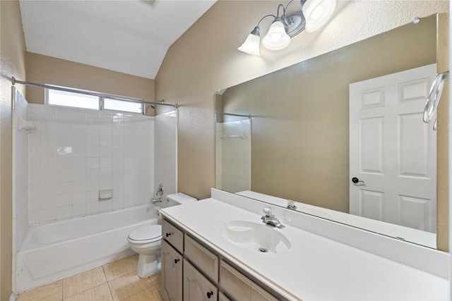 full bathroom with vanity, tile patterned floors, tiled shower / bath, toilet, and lofted ceiling