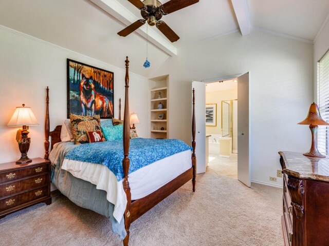 carpeted bedroom with lofted ceiling with beams, ensuite bath, ceiling fan, and crown molding