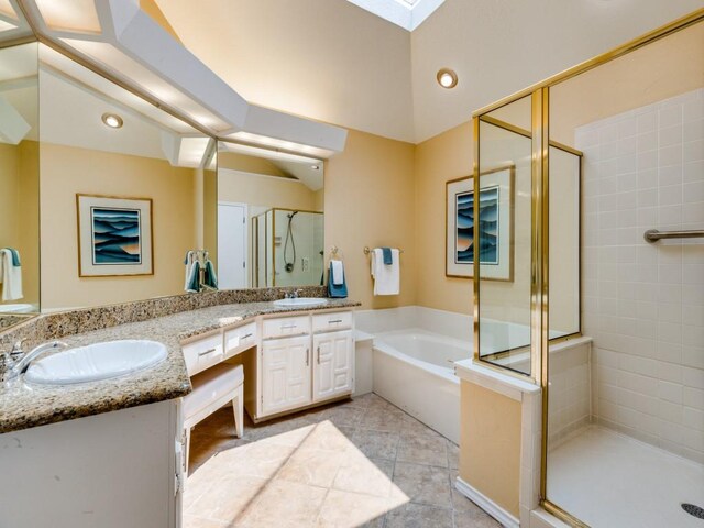 bathroom with tile patterned floors, shower with separate bathtub, and dual bowl vanity