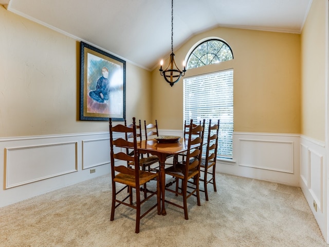 dining room with light carpet, vaulted ceiling, crown molding, and an inviting chandelier