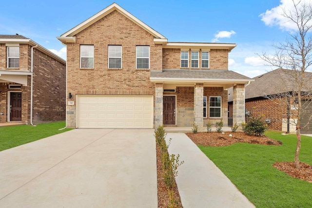 view of front of home featuring a garage, covered porch, and a front lawn