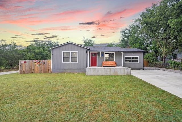 view of front of property with a yard