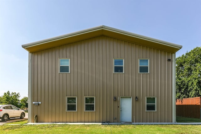 rear view of property with fence