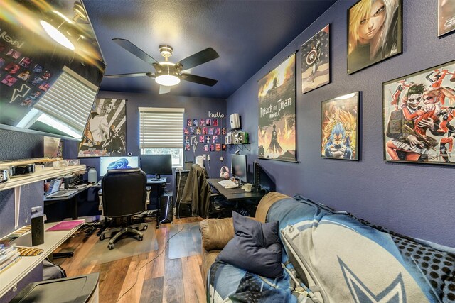 office featuring ceiling fan, hardwood / wood-style flooring, and lofted ceiling