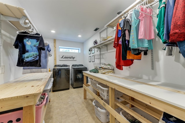 interior space with washer and dryer and light tile patterned floors