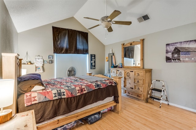 bedroom featuring ceiling fan, lofted ceiling, and wood-type flooring