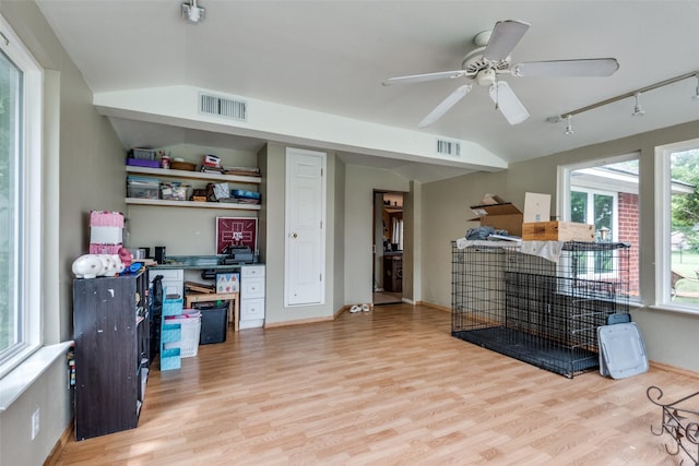 office area with ceiling fan, lofted ceiling, track lighting, and light hardwood / wood-style floors