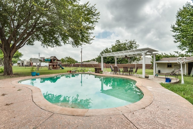 view of swimming pool with an outbuilding, a pergola, a patio area, and a playground