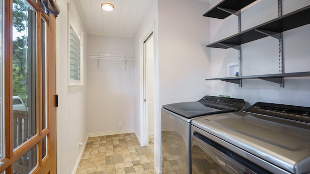 washroom featuring washing machine and clothes dryer and light tile patterned floors