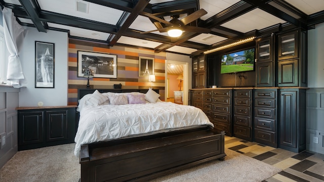 bedroom with light colored carpet, ceiling fan, beam ceiling, and coffered ceiling