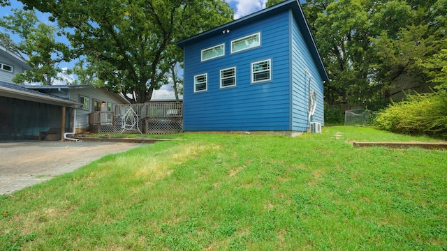 rear view of property featuring a lawn