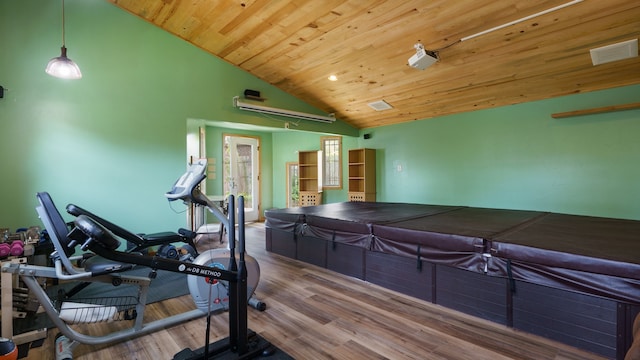 workout room featuring wooden ceiling, hardwood / wood-style flooring, and high vaulted ceiling