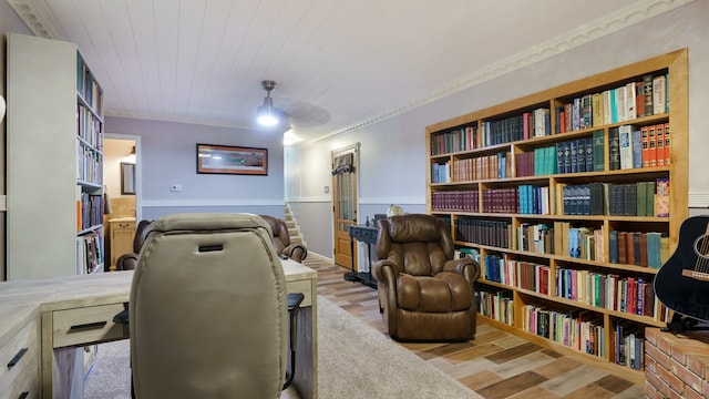 office space featuring crown molding and light hardwood / wood-style flooring