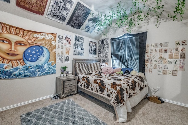 carpeted bedroom featuring baseboards