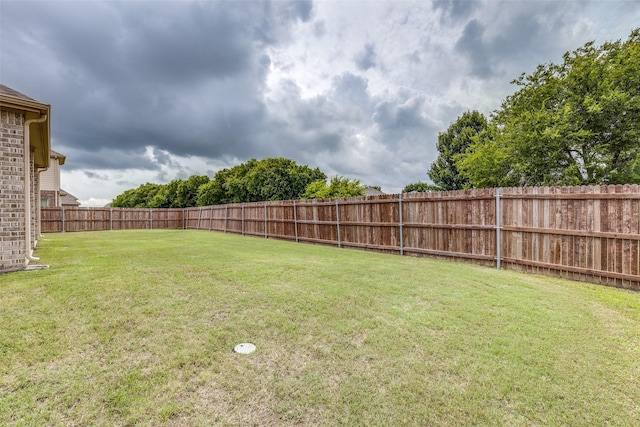 view of yard with a fenced backyard