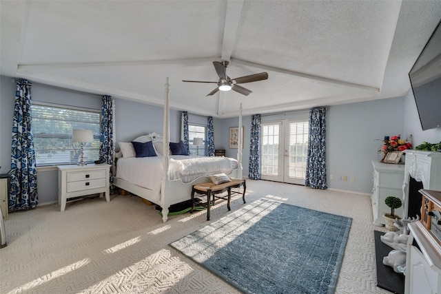 carpeted bedroom featuring ceiling fan, lofted ceiling with beams, french doors, and a textured ceiling