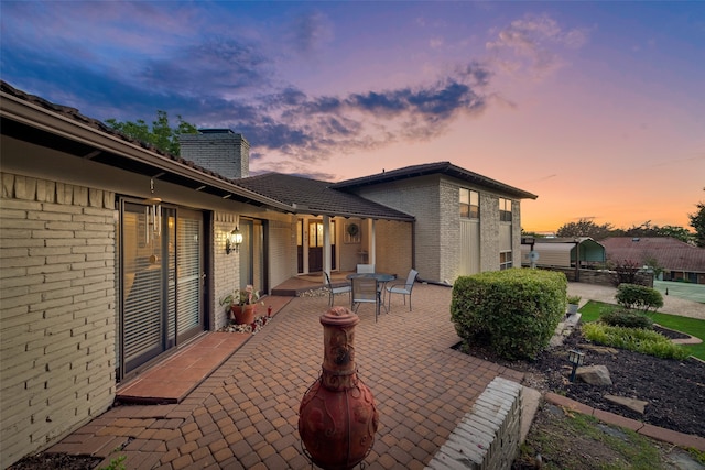 view of patio terrace at dusk